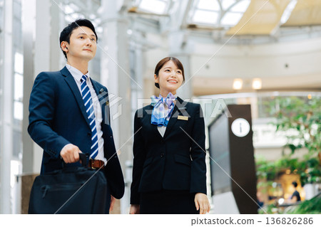 Airport ground staff, male and female. (Photography courtesy of Kansai International Airport (KIX)) Airport ground staff, male and female. (Photography courtesy of Kansai International Airport (KIX)) 136826286
