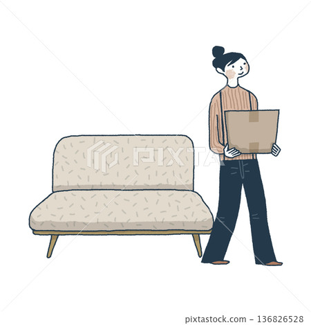 A woman walks past the living room sofa to put away cardboard boxes 136826528