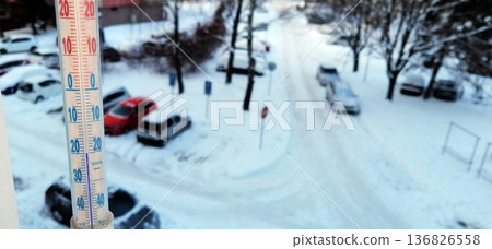 outdoor thermometer showing a temperature below freezing of -20 degrees 136826558
