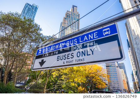 Broadway bus lane sign with buses only restriction above Manhattan street in New York City 136826749