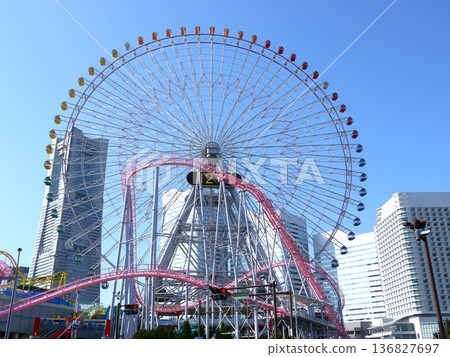 Ferris wheel against the blue sky Ferris wheel against the blue sky 136827697