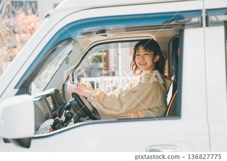 A housewife riding a light van A housewife riding a light van 136827775