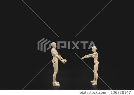 Two plastic mannequins try to hug each other on black background, conceptual art of human connection and intimacy. Two plastic mannequins try to hug each other on black background, conceptual art of human connection and intimacy. 136828147
