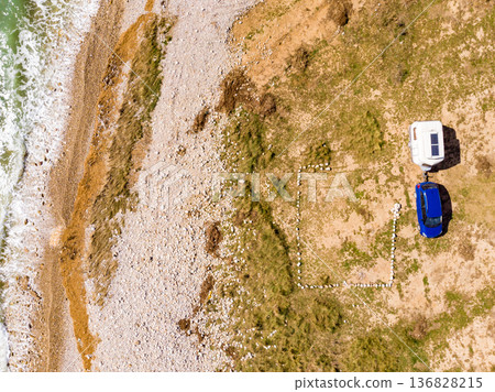 Caravan trailer camping on coast. Aerial view 136828215