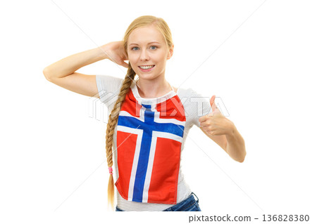Young woman holding norwegian flag. Education. Young woman holding norwegian flag. Education. 136828380