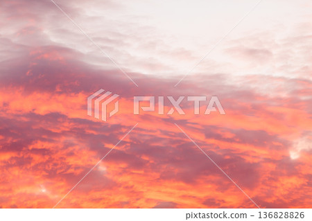 Colorful warm clouds on sky at sunset Colorful warm clouds on sky at sunset 136828826