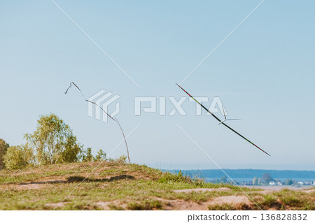 RC soaring plane on blue sky 136828832