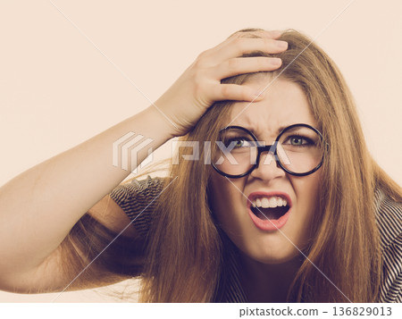 Dissatisfied woman after loosing video game Dissatisfied woman after loosing video game 136829013