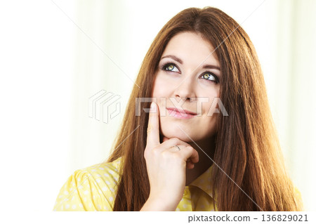 Happy woman thinking wondering 136829021