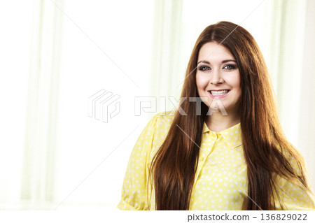 Portrait of beautiful cheerful young woman 136829022
