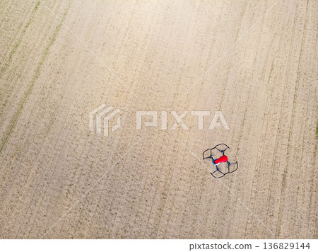 Drone over crop agricultural fields. Drone over crop agricultural fields. 136829144