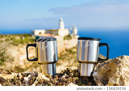 Thermal mugs, thermos on nature. Travel outdoor picnic. Thermal mugs, thermos on nature. Travel outdoor picnic. 136829156