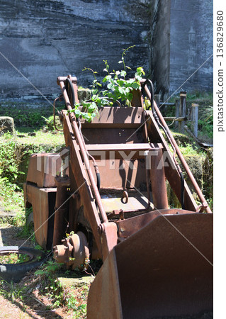 Rusty heavy machinery and fresh greenery remain at the site of a former quarry on Mt. Nokogiri 136829680