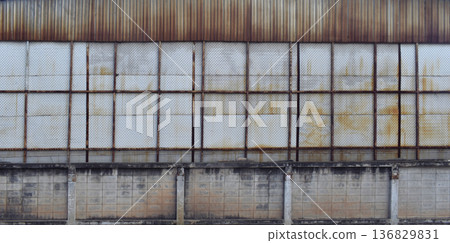 Variety pattern building facade. Old fence wall. 136829831