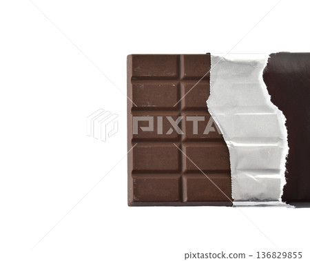 Chocolate bar wrapped in paper and foil on a white background 136829855