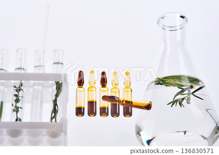 Herbal extracts in ampoules and laboratory glassware for natural medicine research 136830571