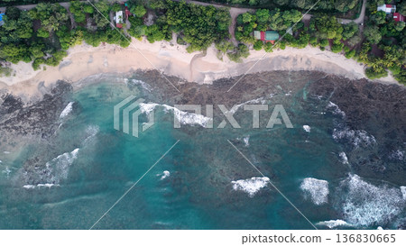 Avellanas Beach Costa Rica aerial view ocean waves reaching coastline Avellanas Beach Costa Rica aerial view ocean waves reaching coastline 136830665