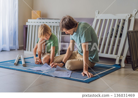 Father and older brother assembling a baby crib at home, preparing for a newborn arrival. Warm family moment full of care and anticipation. Parenthood, sibling bond and home preparation concept Father and older brother assembling a baby crib at home, preparing for a newborn arrival. Warm family moment full of care and anticipation. Parenthood, sibling bond and home preparation concept 136831469
