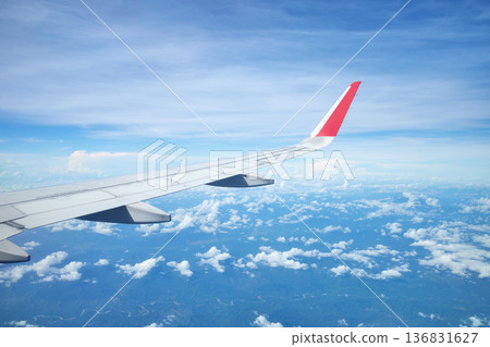 The wing of an airplane flying over the island of Borneo, Malaysia. The wing of an airplane flying over the island of Borneo, Malaysia. 136831627
