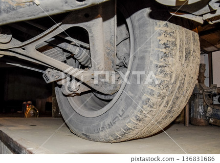 Rear wheel of the car with the elements of the suspension system. Car service Rear wheel of the car with the elements of the suspension system. Car service 136831686