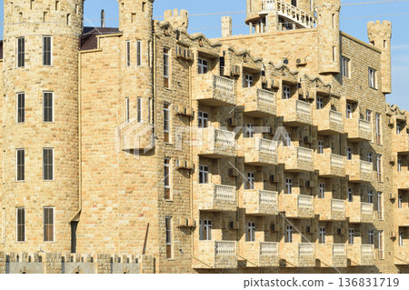 The hotel building, covered with decorative stone 136831719