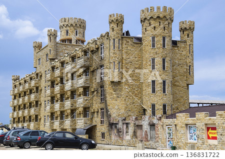 The hotel building, covered with decorative stone. Multi-storey hotel with a decorative trim, which is called Dagestani stone. The hotel building, covered with decorative stone. Multi-storey hotel with a decorative trim, which is called Dagestani stone. 136831722