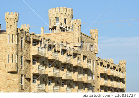 The hotel building, covered with decorative stone 136831727