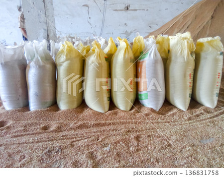 Heap of grains of barley and wheat in stock Heap of grains of barley and wheat in stock 136831758