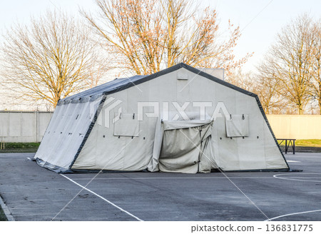 huge tent for a large group of people. Army headquarters tent. Awning canopy. 136831775