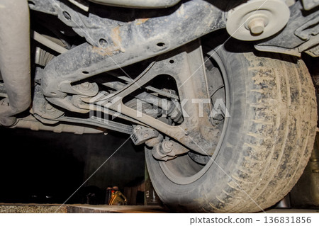 Rear wheel of the car with the elements of the suspension system. Car service Rear wheel of the car with the elements of the suspension system. Car service 136831856