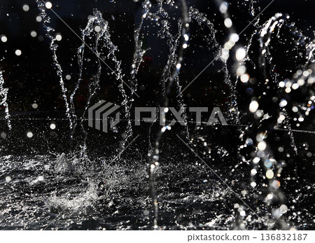 'Frozen' dropes of water in fountain of capital city or NYC in Central park : shiny in sunbeams 'Frozen' dropes of water in fountain of capital city or NYC in Central park : shiny in sunbeams 136832187