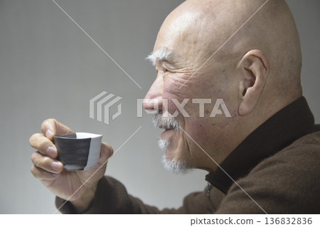 An elderly man drinking sake with a smile 136832836