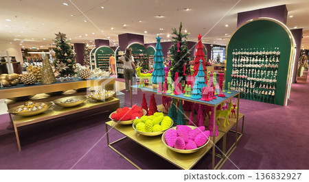 Berlin, Germany - September 19, 2025: Colorful holiday decorations displayed in a vibrant retail store setting Berlin, Germany - September 19, 2025: Colorful holiday decorations displayed in a vibrant retail store setting 136832927