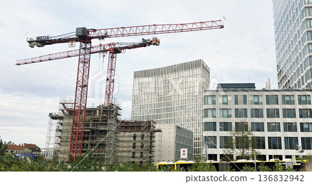 Berlin, Germany - September 25, 2025: Construction site with cranes and modern buildings in urban landscape 136832942