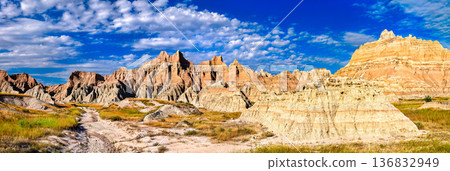 Badlands National Park South Dakota. Scenic landscape features rugged rock formations rising from a grassy prairie along the loop road south of the wall 136832949