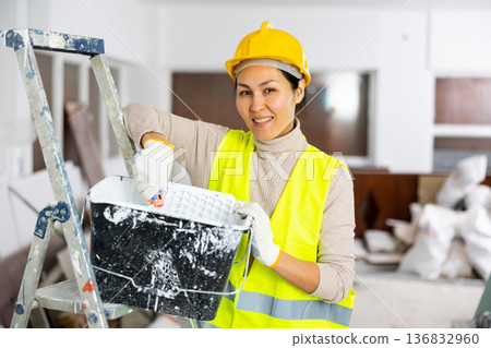 Woman repair worker inside apartment 136832960