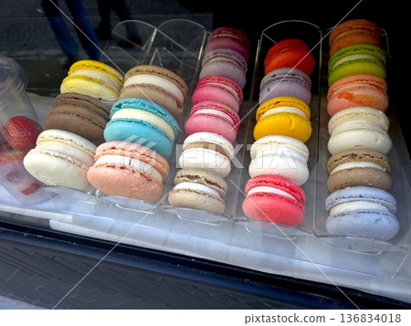 Colorful Macaroon Cookies Displayed in a Glass Case at a Bakery in the Afternoon 136834018