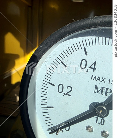 Manometer Dial Showing Pressure Readings in a Workshop at a Specific Time of Day 136834019