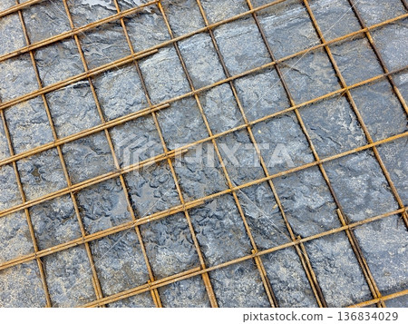 Reinforcing Mesh Placed on Wet Concrete During Construction on a Building Site Reinforcing Mesh Placed on Wet Concrete During Construction on a Building Site 136834029