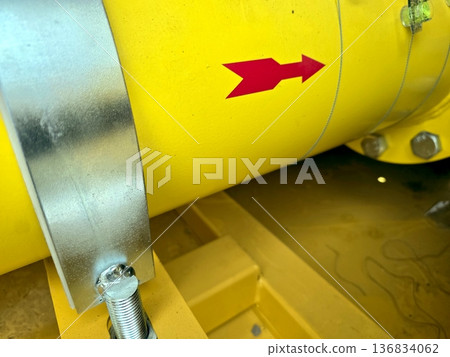 Yellow Gas Pipe With Red Arrow Indicating Direction at a Construction Site Yellow Gas Pipe With Red Arrow Indicating Direction at a Construction Site 136834062