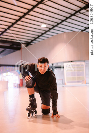 Focused Rollerblader Ready to Start an Intense Skating Session 136834967