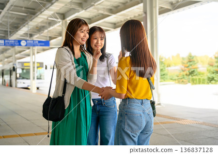 Farewell to a friend at the bus stop 136837128