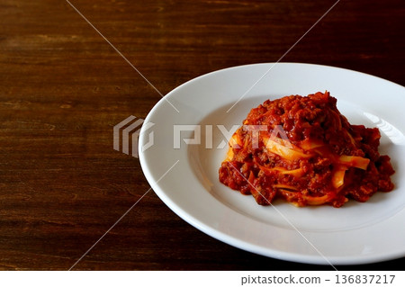 Tagliatelle with bolognese on the table background Tagliatelle with bolognese on the table background 136837217