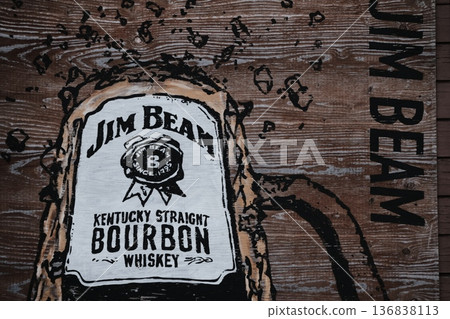 The scent of American vintage. A wild bar scene. Bourbon whiskey shining against the wood paneling. The scent of American vintage. A wild bar scene. Bourbon whiskey shining against the wood paneling. 136838113