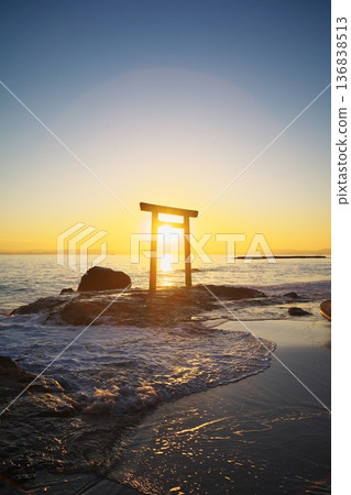Autumn on the Chita Peninsula: View of the sunset over the torii gate at Tsubutegaura 136838513