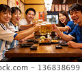 Soccer fans toasting at an izakaya 136838699