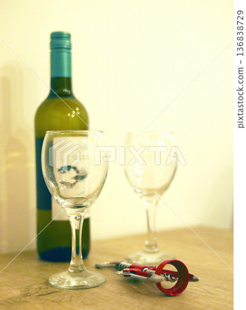 Wine and Glasses on a Wooden Table 136838729