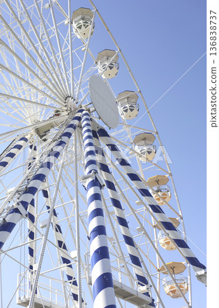 Giant Ferris Wheel Against Clear Blue Sky 136838737