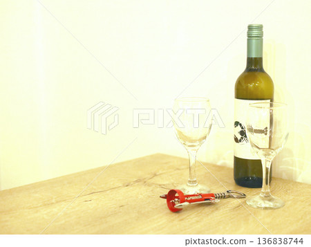 Wine Bottle with Glasses and Corkscrew on Table 136838744
