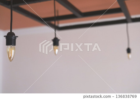 Warm hanging bulbs create a cozy atmosphere Warm hanging bulbs create a cozy atmosphere 136838769